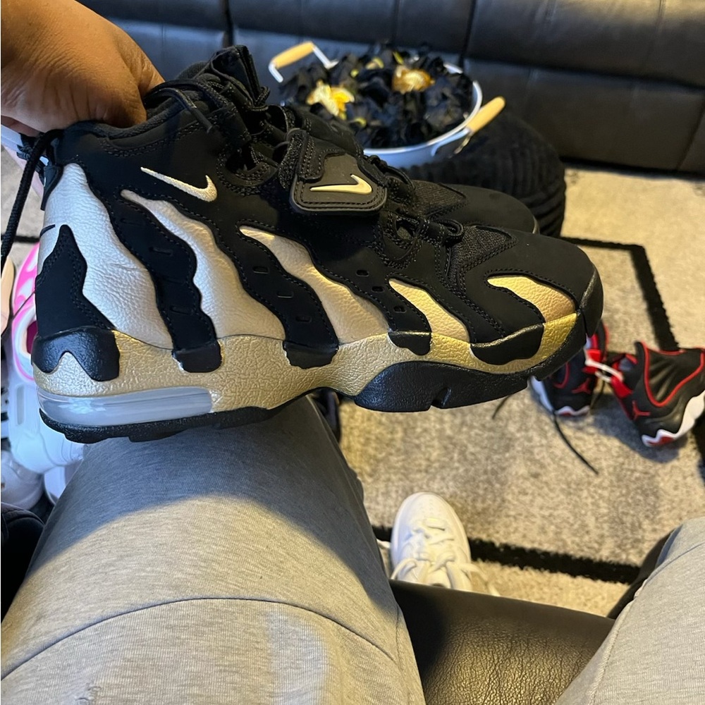 Nike Black and Gold Sneakers with Dynamic Design
